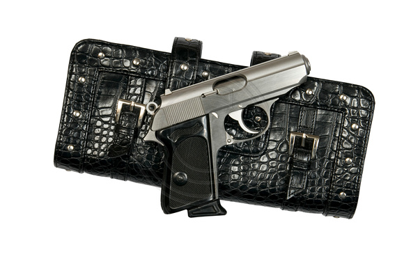 Gun and purse stock photos